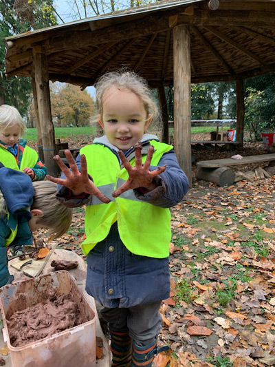 Child with muddy hands